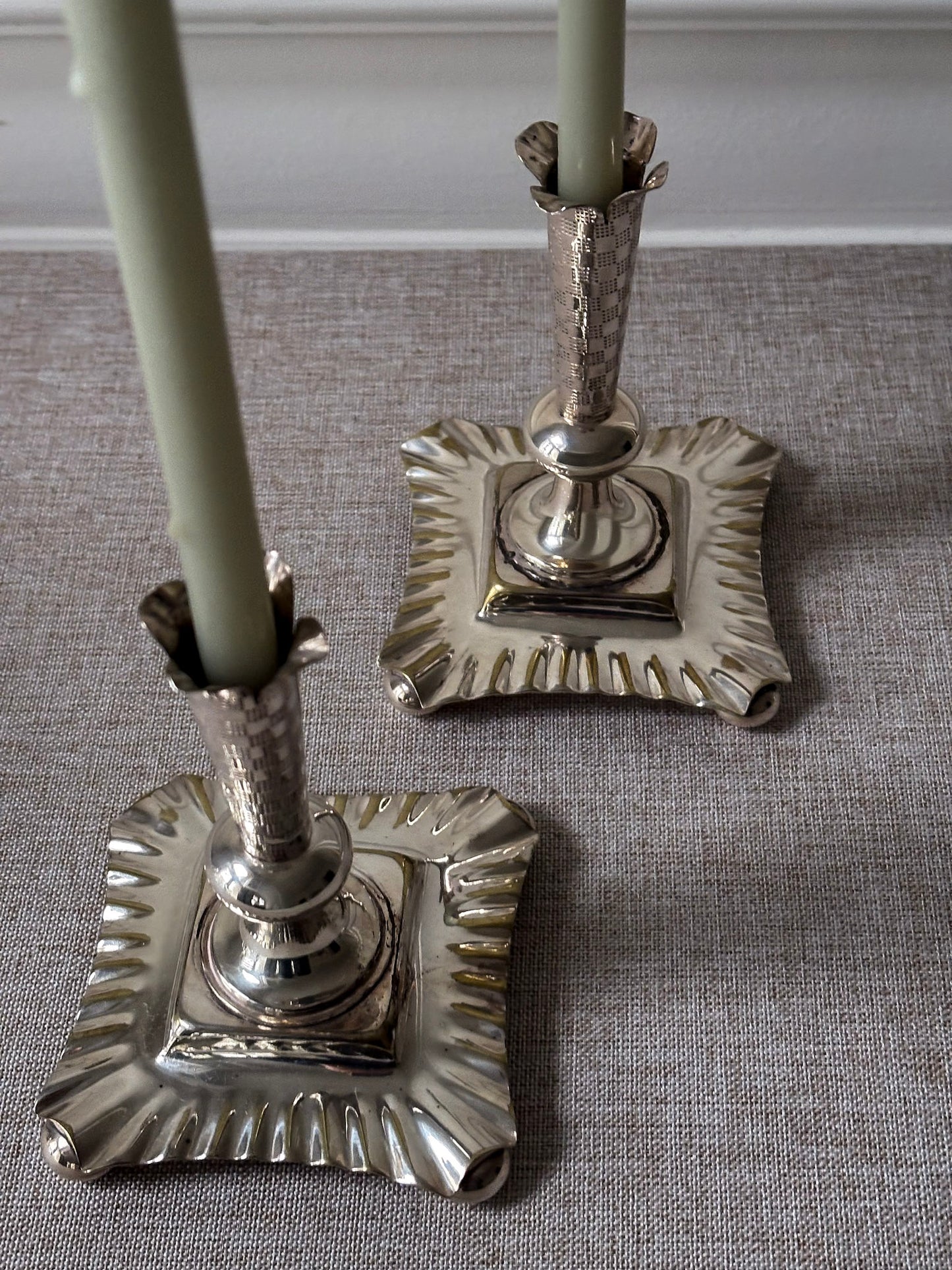 A Pair of Silver-Plated Chequered Candlesticks