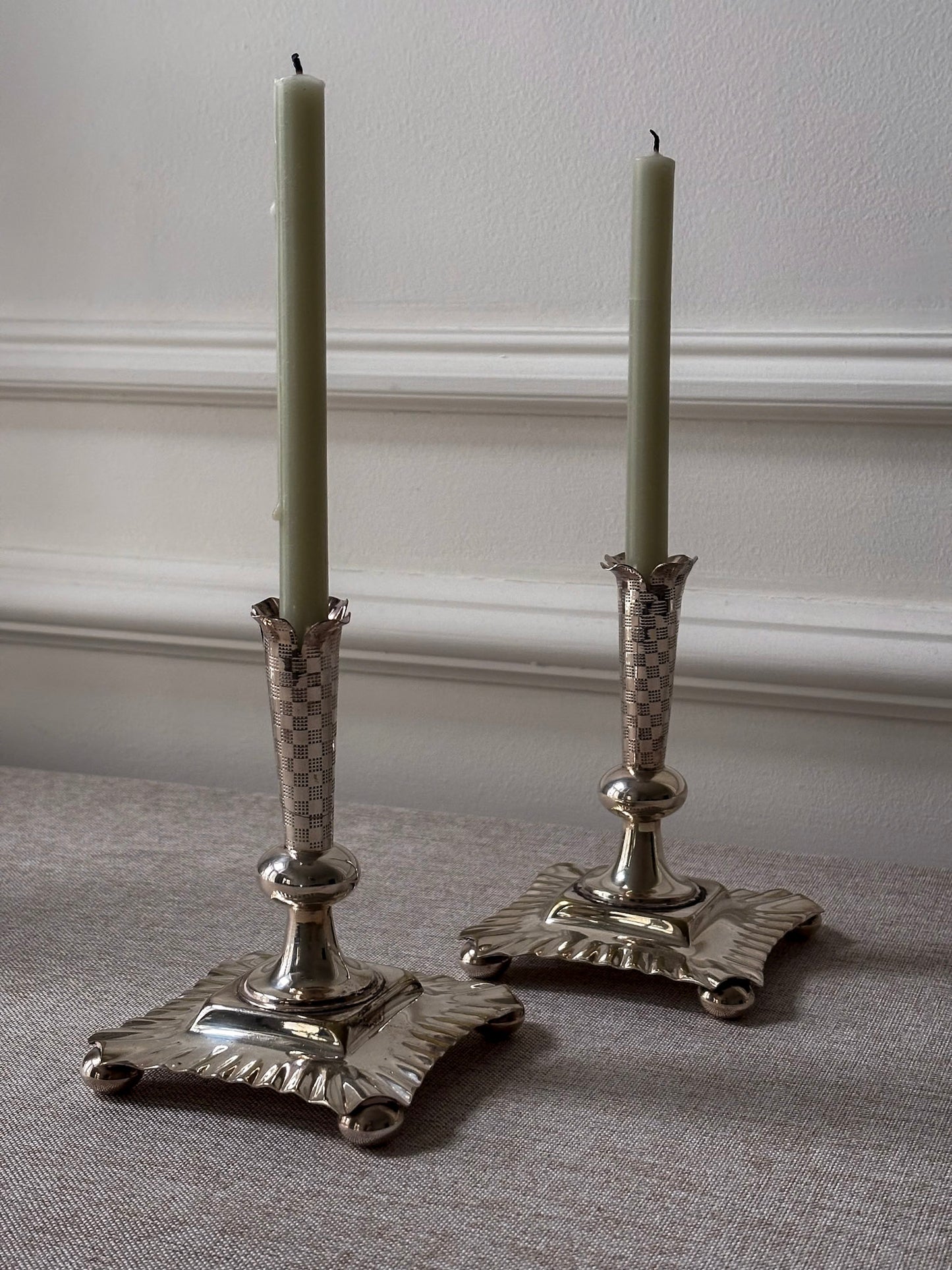 A Pair of Silver-Plated Chequered Candlesticks