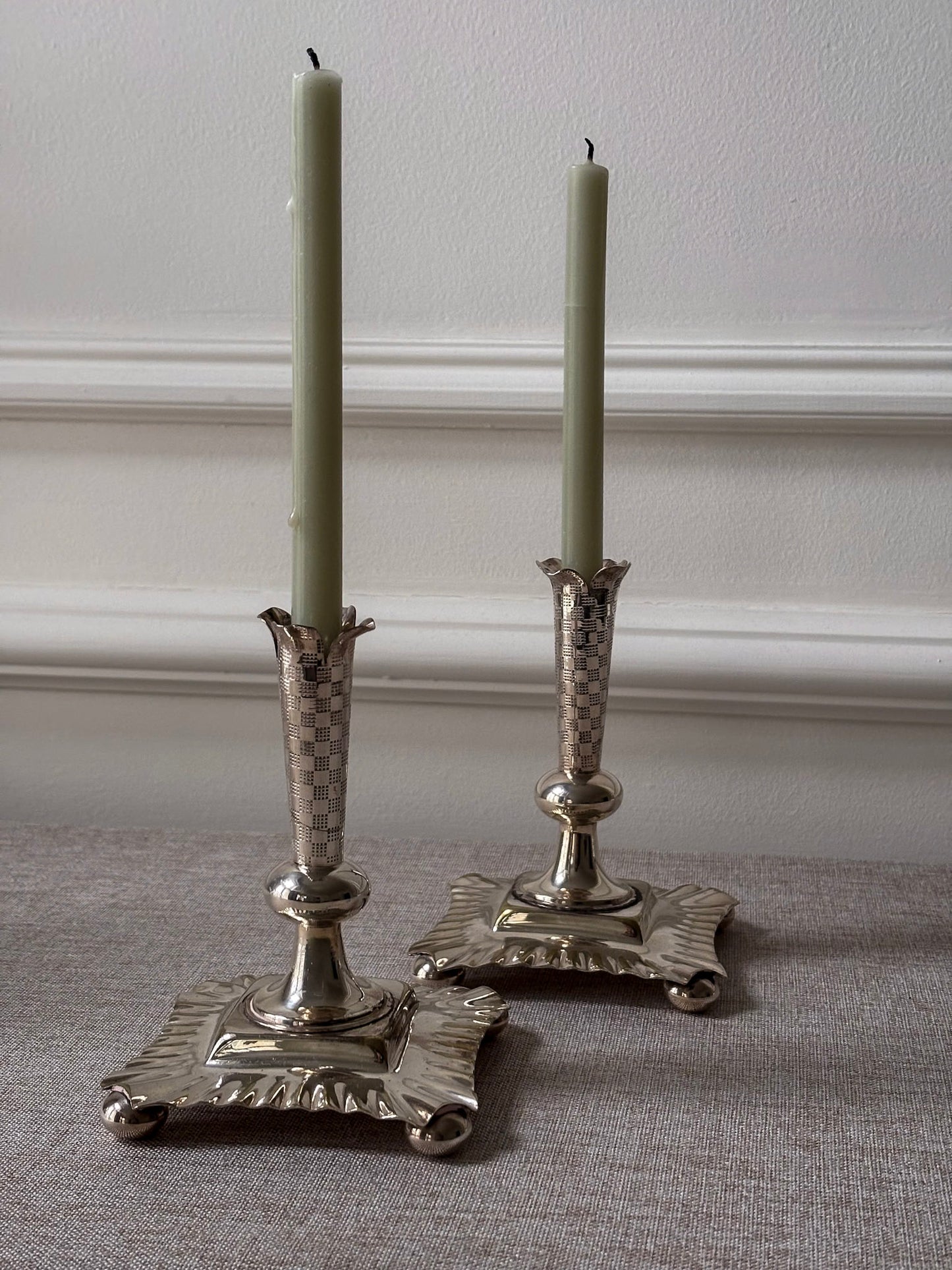 A Pair of Silver-Plated Chequered Candlesticks