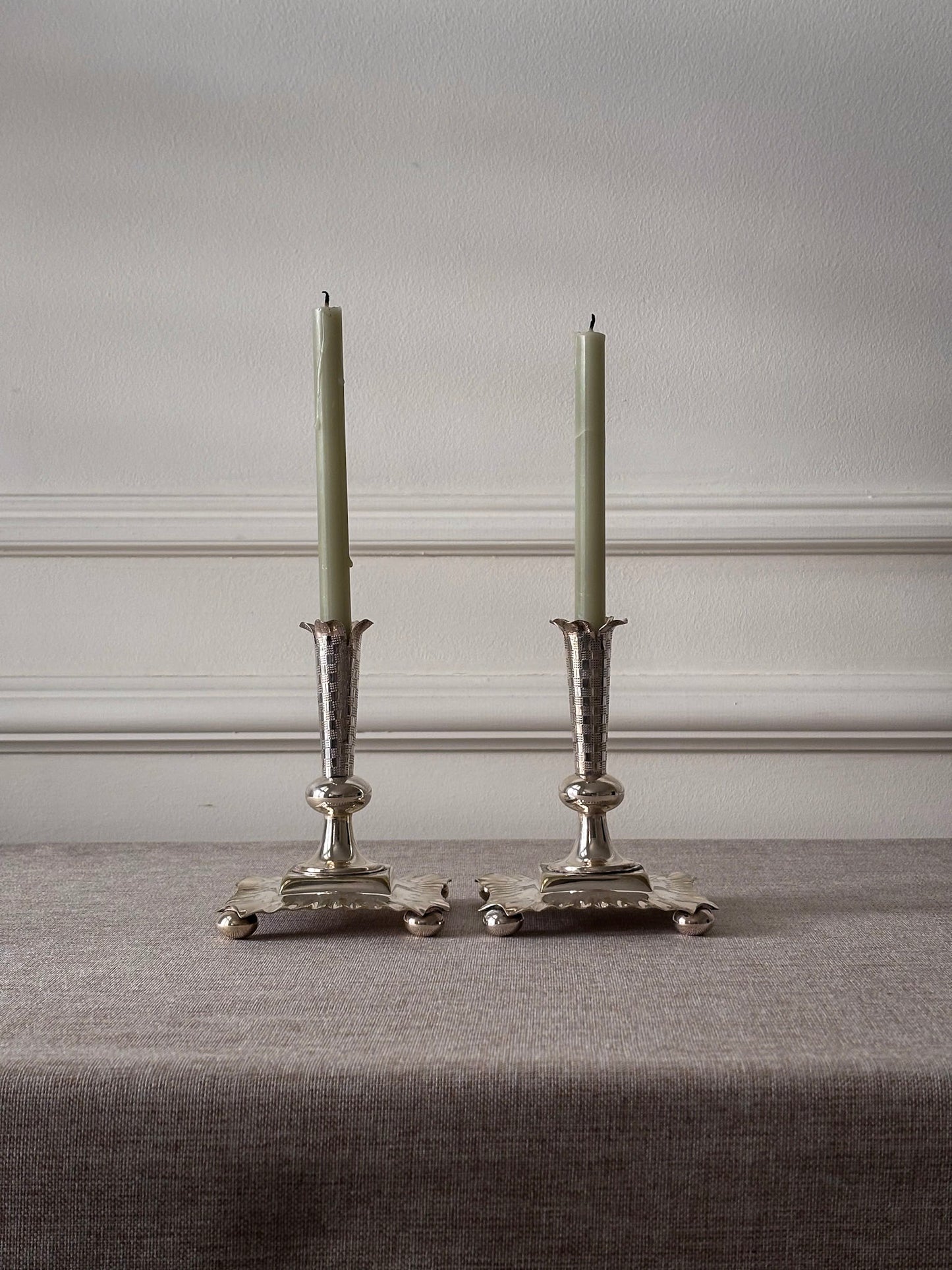 A Pair of Silver-Plated Chequered Candlesticks